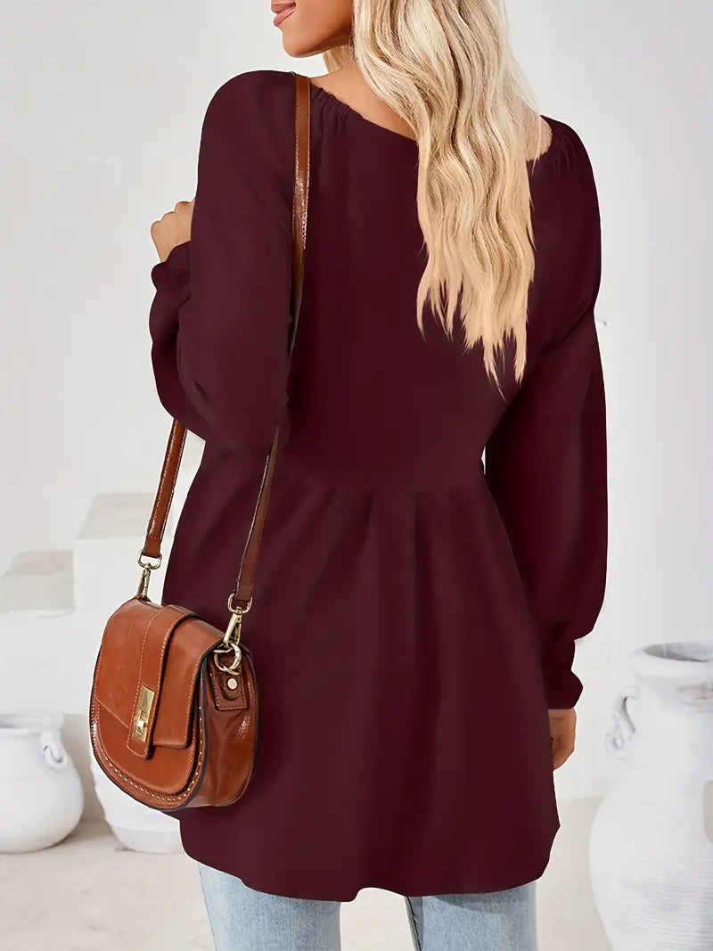 Solid-colored, V-neck, long-sleeved minidress that's ideal for spring and fall, a sophisticated, machine-washable